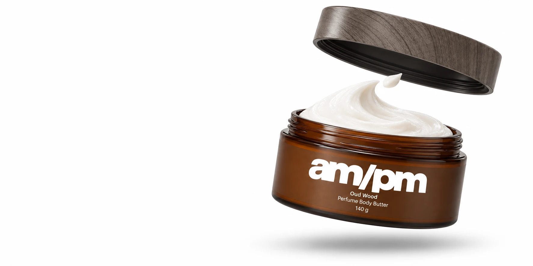AM/PM Oud Wood body butter, with its woodprint lid lifted above the cream.